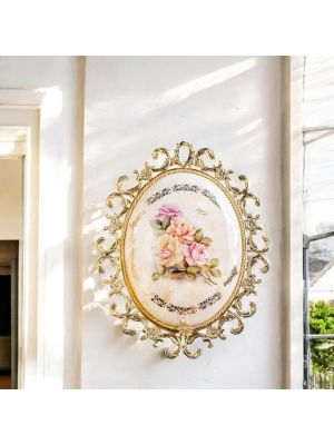 Medallion in fine ceramic with elegant floral decorations and golden details, handmade.