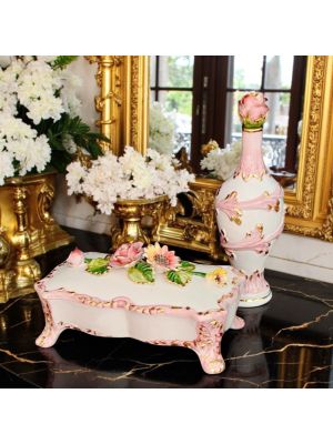 Box with bottle decorated in baroque style ceramic, with flowers and golden details.