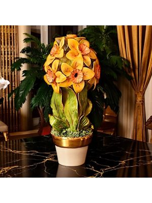 Artistic ceramic plant decorated with daffodils and golden details, made entirely by hand.