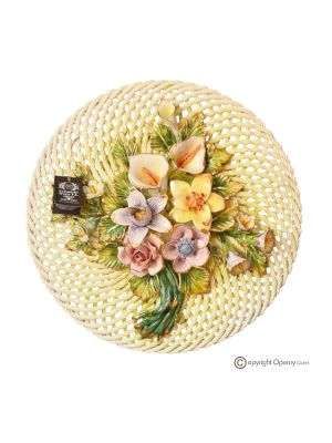Wall decoration in fine ceramic, embellished with flowers and golden details, handmade.