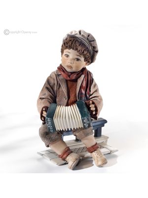 LITTLE BLUES - Collectibles: Porcelain accordionist musician.