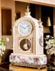 Refined ceramic pendulum clock, with elegant golden decorations, handcrafted.