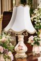 Lamp in fine ceramic with elegant floral and gold decorations, handmade.