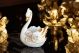 Baroque style ceramic swan, table decoration embellished with roses, crystals and golden details.