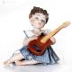 STELLA Porcelain figurine, musician with guitar, a refined touch.
